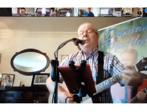 Damien McHale singing to care home residents on Zoom
